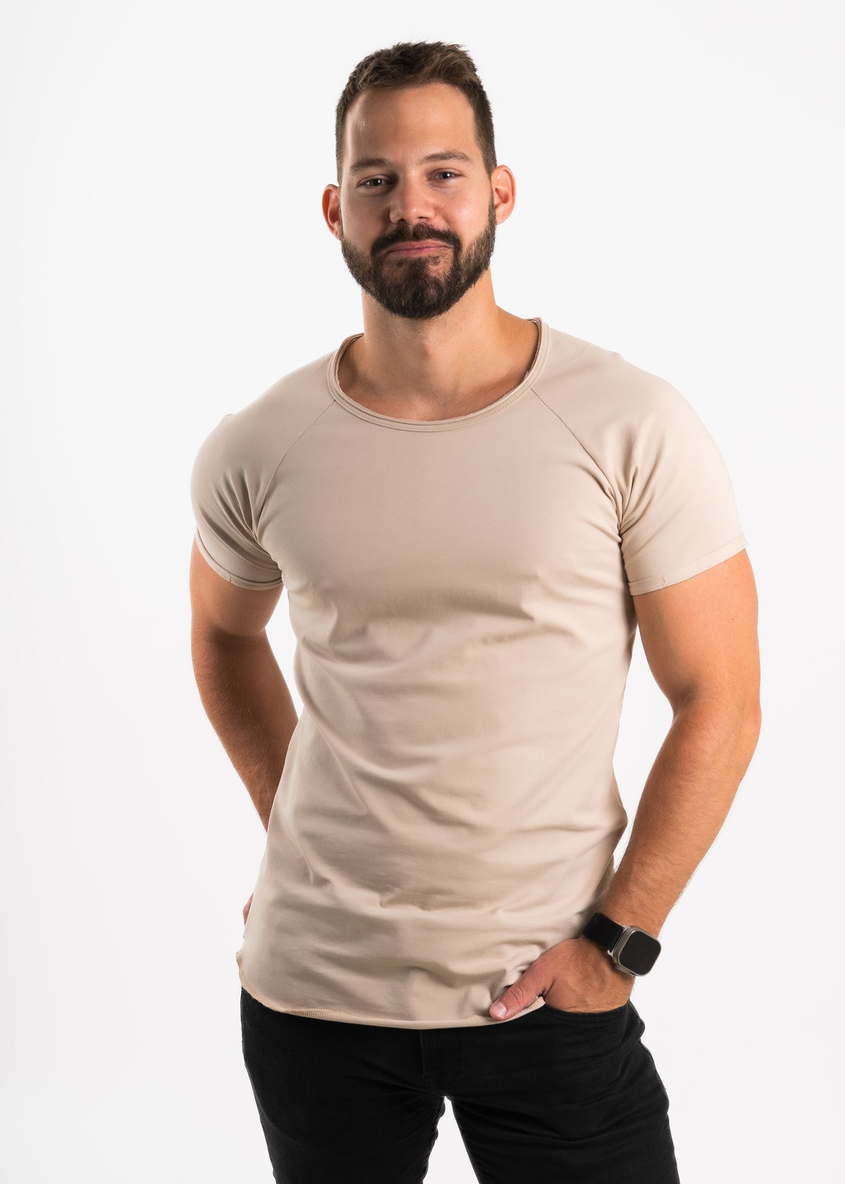 Man wearing a beige t-shirt on a white background