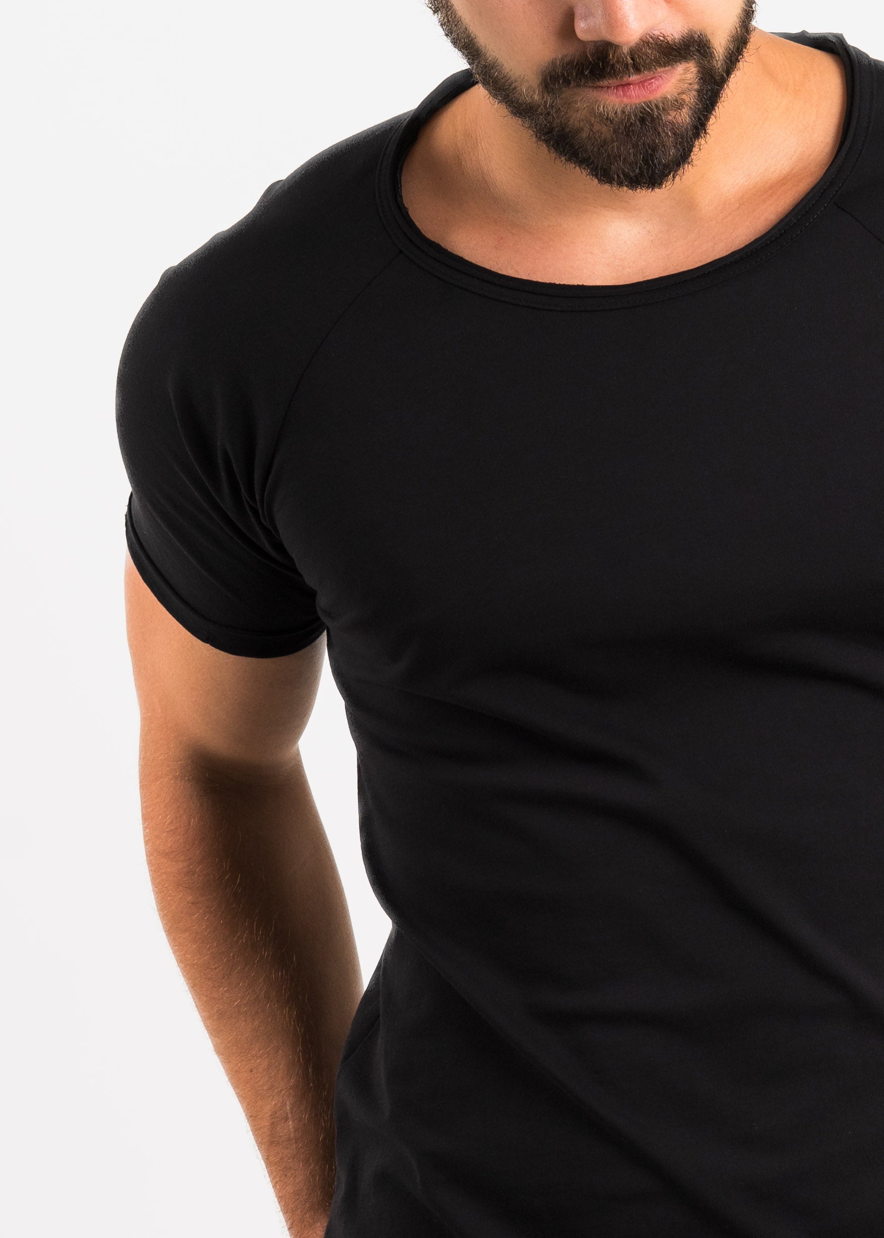 Man wearing a black t-shirt against a white background