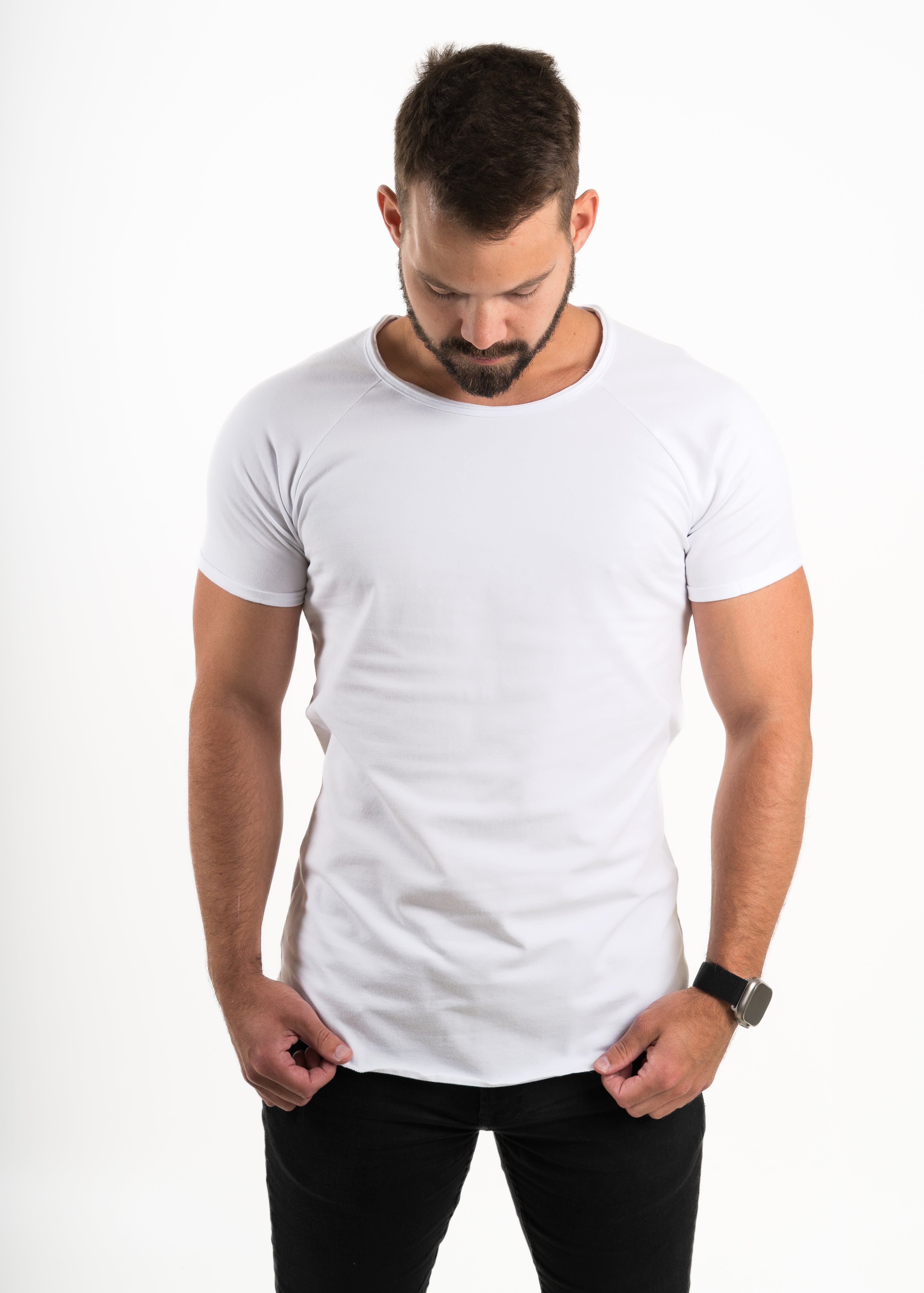 Man wearing a plain white Norloom t-shirt on a white background