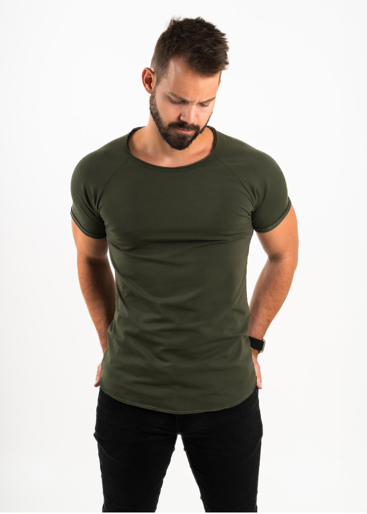 Man wearing an olive green t-shirt on a white background
