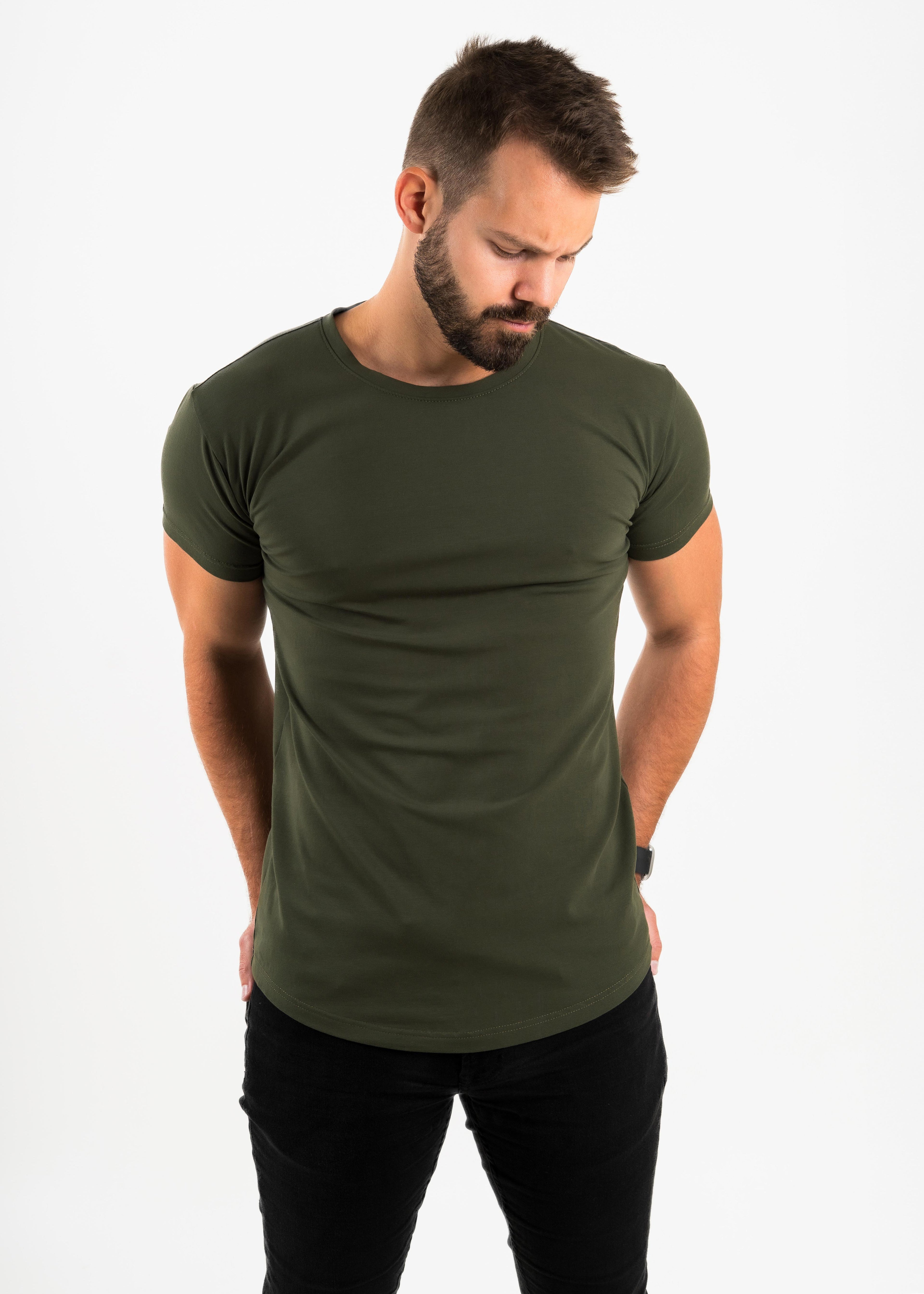 Man wearing an olive green t-shirt on a white background
